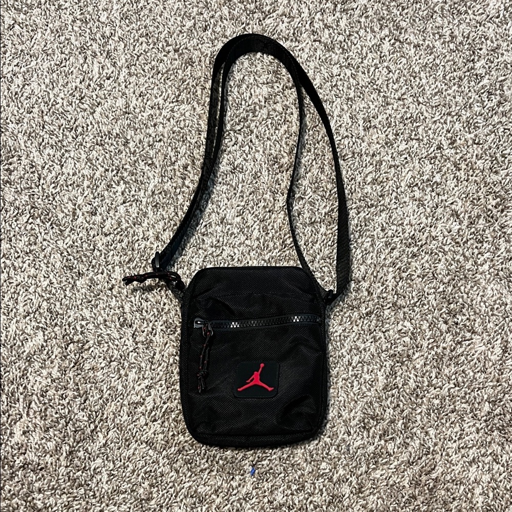 Jordan Compact Black Messenger Bag with Red Logo